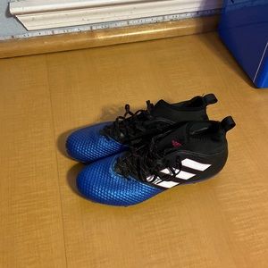 Black and blue adidas soccer cleats